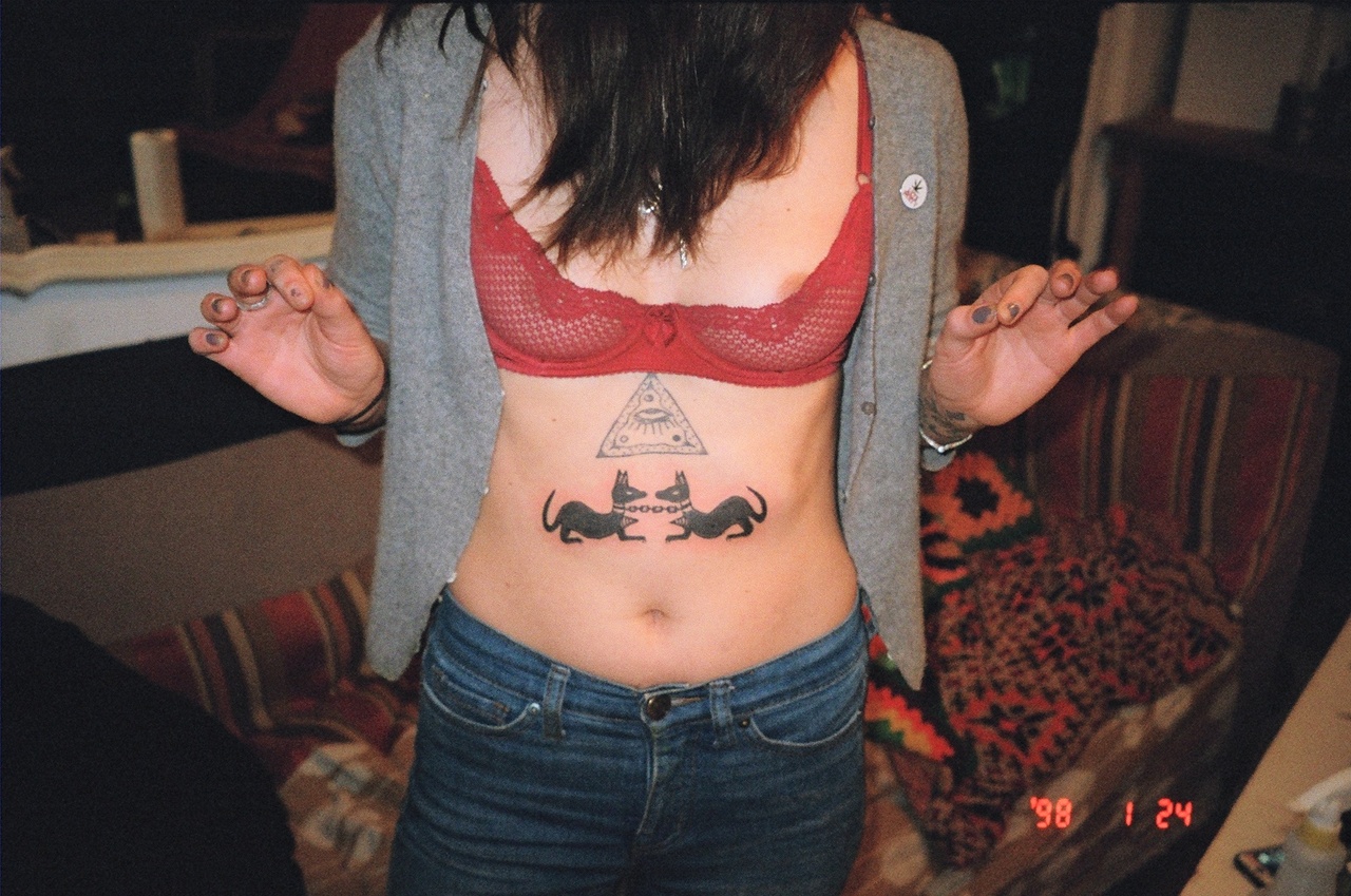 Mia after tattooing her own stomach. 
